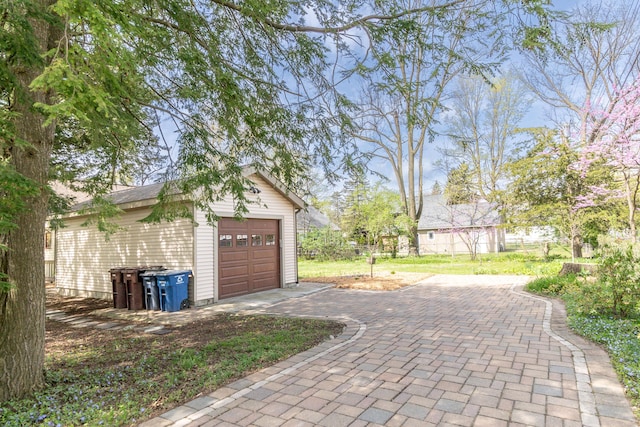 garage featuring driveway