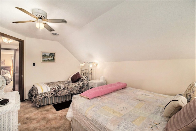 bedroom featuring visible vents, ceiling fan, light colored carpet, and lofted ceiling