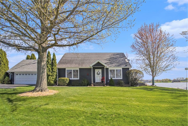 view of front of house with a water view and a front yard
