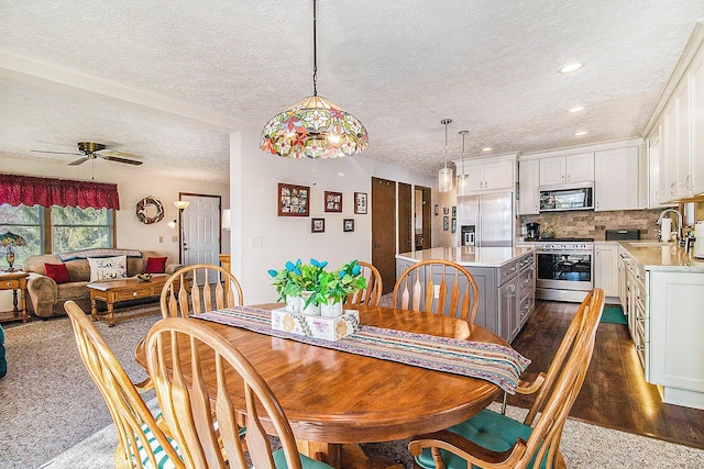 dining room featuring recessed lighting, a textured ceiling, ceiling fan, and dark wood-style floors