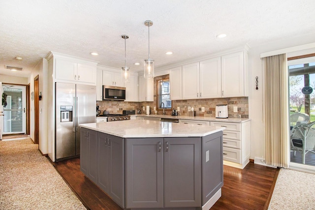 kitchen with visible vents, dark wood-style flooring, gray cabinets, white cabinets, and stainless steel appliances
