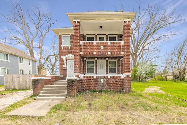 1989 Gladstone St, Detroit, MI 48206 - view of front of property with fence, a front yard, brick siding, and a balcony