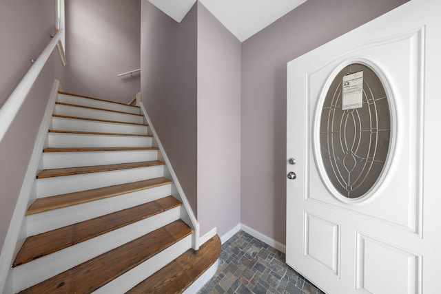 1989 Gladstone St, Detroit, MI 48206 - entrance foyer featuring baseboards, stone finish flooring, and stairway