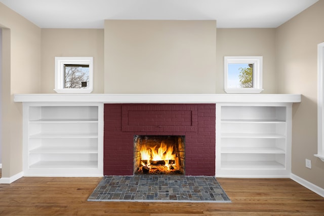 1989 Gladstone St, Detroit, MI 48206 - details featuring baseboards, built in features, wood finished floors, and a fireplace