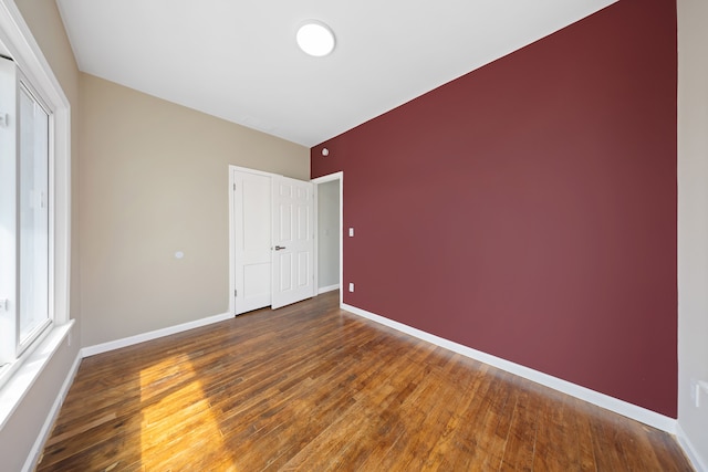 1989 Gladstone St, Detroit, MI 48206 - unfurnished bedroom with baseboards, wood finished floors, and a closet
