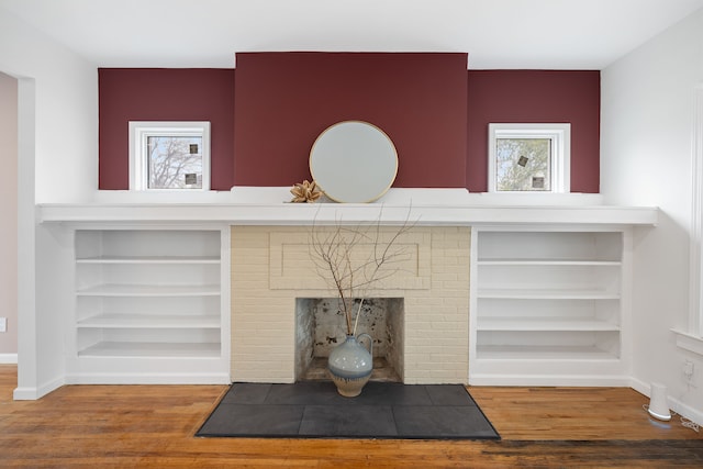 1989 Gladstone St, Detroit, MI 48206 - interior details with baseboards, a fireplace, wood finished floors, and built in shelves