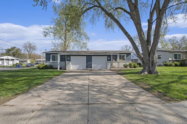 single story home featuring an attached garage, concrete driveway, and a front yard
