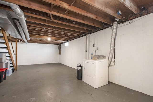 unfinished basement with washer / clothes dryer and stairway