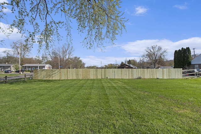 view of yard featuring fence