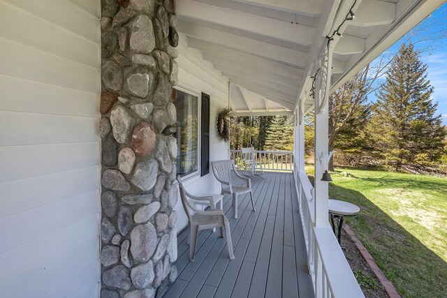3121 Grace Rd, Frankfort, MI 49635 - wooden terrace with a porch and a lawn