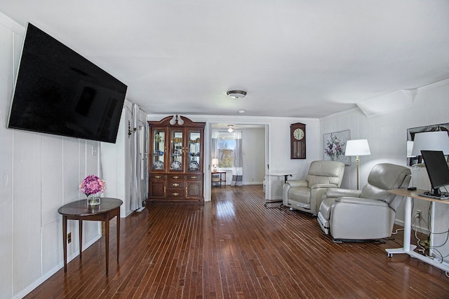 3121 Grace Rd, Frankfort, MI 49635 - living area with dark wood-style flooring, ornamental molding, and baseboards