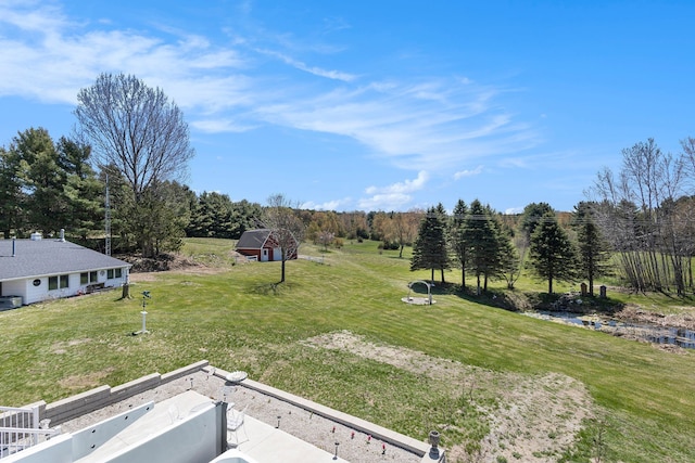 3121 Grace Rd, Frankfort, MI 49635 - view of grassy yard with an outbuilding and a forest view