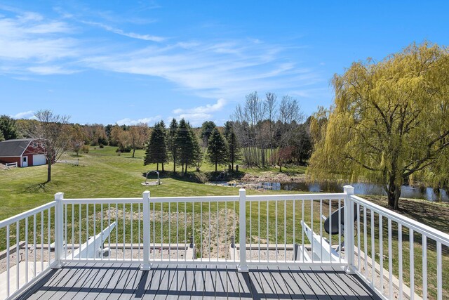 3121 Grace Rd, Frankfort, MI 49635 - wooden deck featuring a water view and a yard