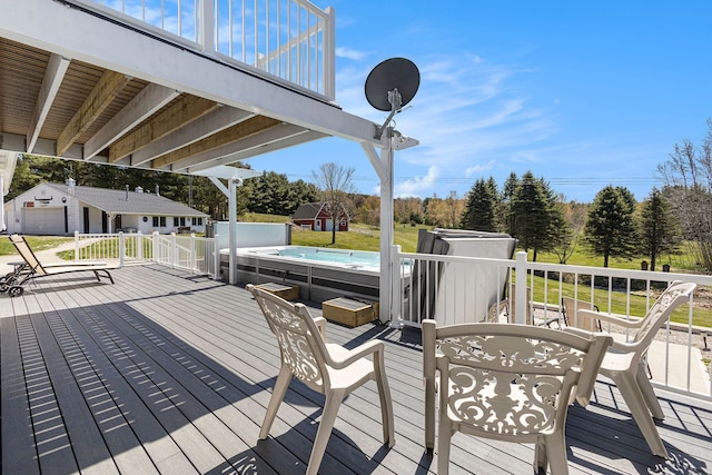 3121 Grace Rd, Frankfort, MI 49635 - deck featuring an outdoor structure, a shed, view of wooded area, and a swimming pool