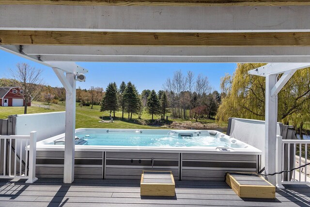 3121 Grace Rd, Frankfort, MI 49635 - view of swimming pool featuring a hot tub and a wooden deck