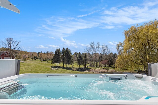 3121 Grace Rd, Frankfort, MI 49635 - view of pool with a hot tub and a lawn