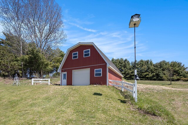 3121 Grace Rd, Frankfort, MI 49635 - garage featuring a garage and driveway