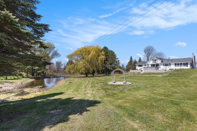 3121 Grace Rd, Frankfort, MI 49635 - view of green lawn featuring a water view