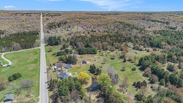 3121 Grace Rd, Frankfort, MI 49635 - aerial view of property and surrounding area with a heavily wooded area