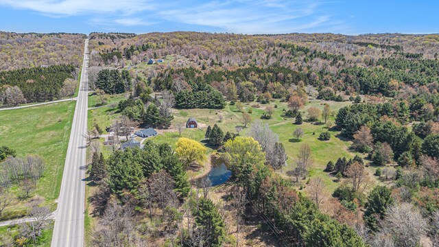 3121 Grace Rd, Frankfort, MI 49635 - aerial view of property and surrounding area with a heavily wooded area