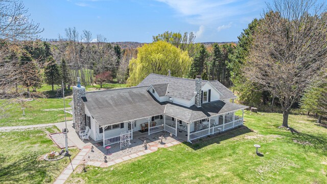 3121 Grace Rd, Frankfort, MI 49635 - aerial view of property and surrounding area featuring a forest