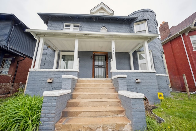 700 W Euclid St, Detroit, MI 48202 - view of front of house featuring a porch and brick siding