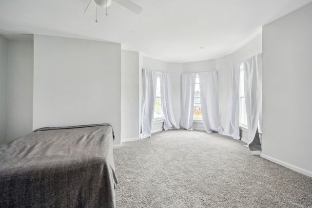 700 W Euclid St, Detroit, MI 48202 - unfurnished bedroom featuring baseboards, ceiling fan, and carpet floors