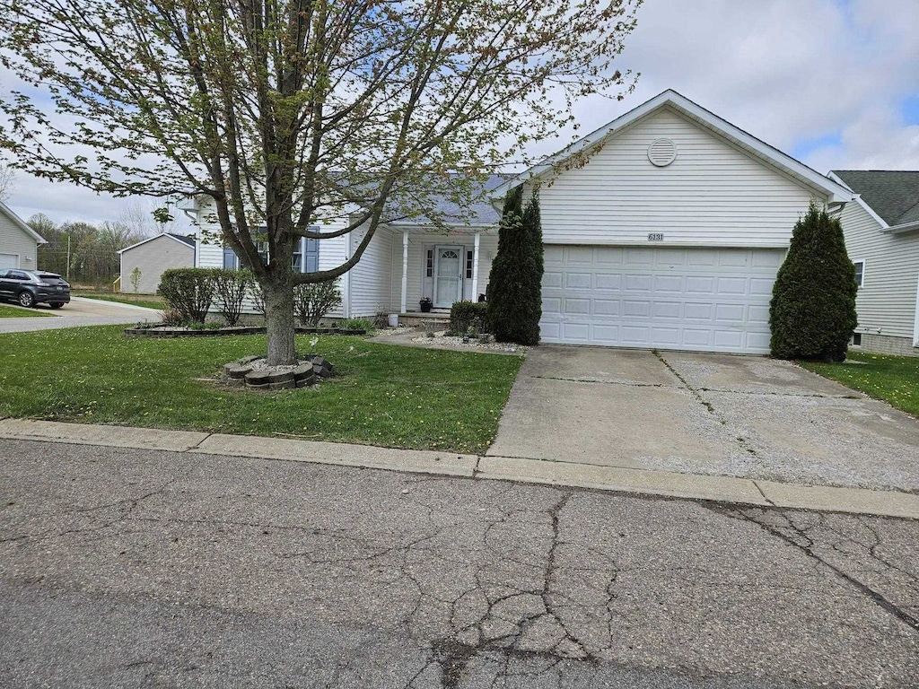 6131 Fountain View Dr, Swartz Creek, MI 48473 - single story home with a garage, driveway, and a front yard