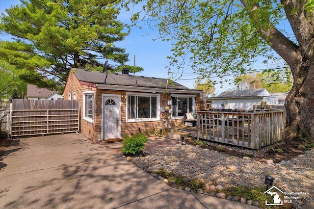 view of front of house featuring fence and a wooden deck