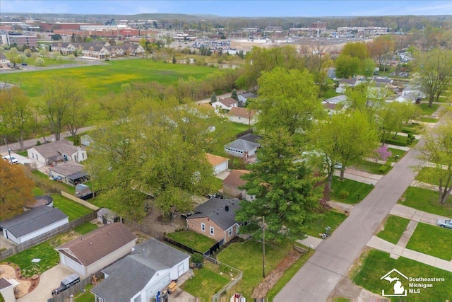 birds eye view of property with a residential view