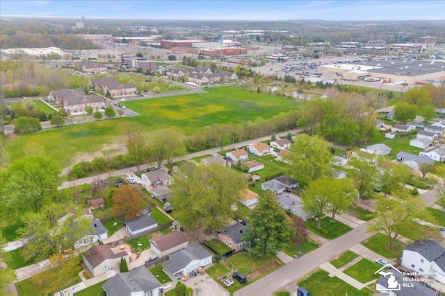 birds eye view of property with a residential view