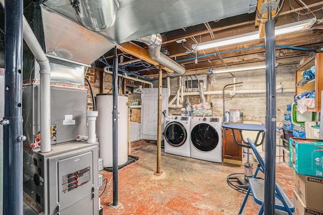 unfinished below grade area with gas water heater and washer and dryer