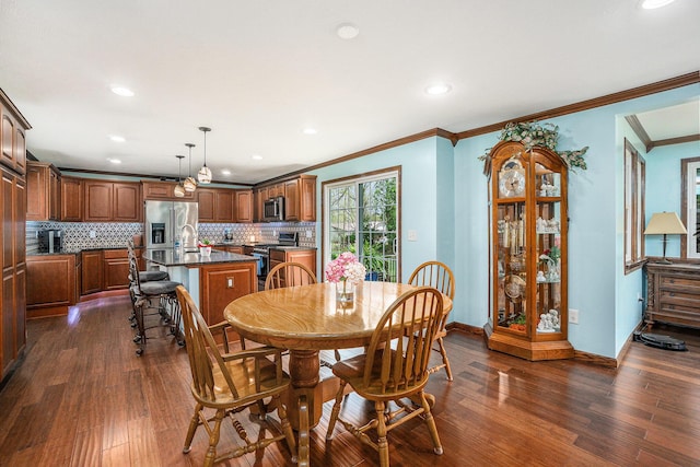 dining area featuring recessed lighting, baseboards, ornamental molding, and dark wood-style flooring