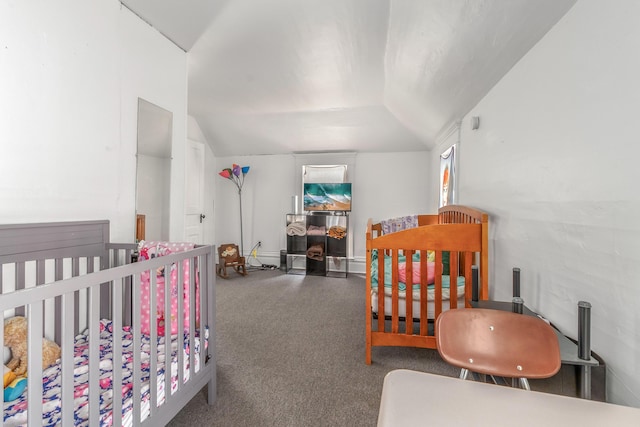 carpeted bedroom with lofted ceiling