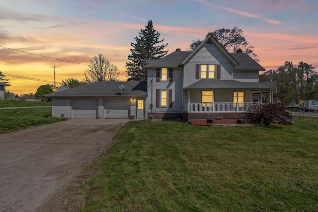 view of front of home featuring a garage, a porch, a chimney, a lawn, and driveway