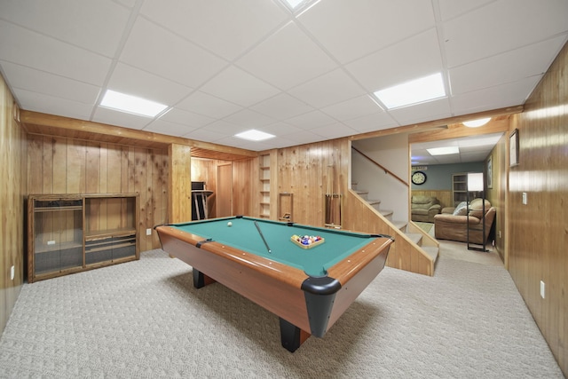 game room featuring carpet flooring, wood walls, billiards, and a paneled ceiling