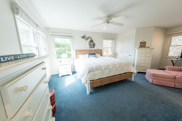 carpeted bedroom with a ceiling fan and a closet