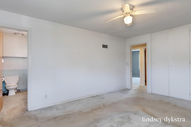 unfurnished bedroom featuring a ceiling fan, light colored carpet, visible vents, and a closet