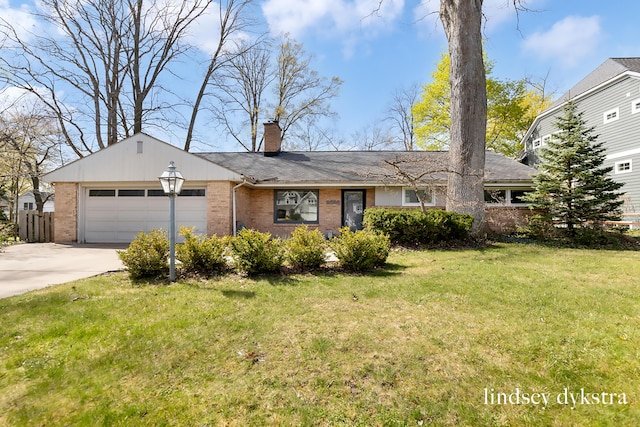 single story home featuring driveway, a chimney, a front yard, brick siding, and an attached garage