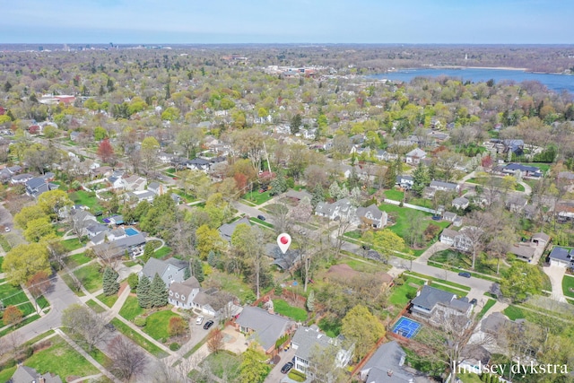 bird's eye view featuring a residential view and a water view