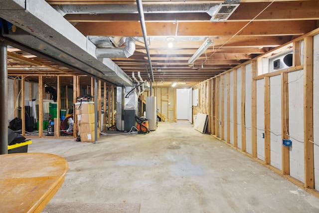unfinished basement featuring heating unit and water heater