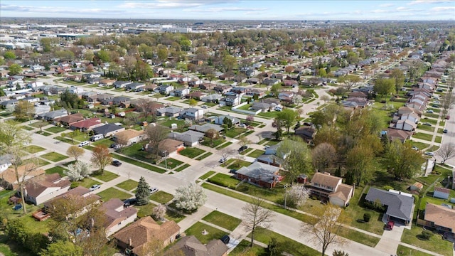 birds eye view of property with a residential view