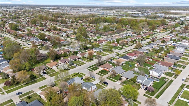 birds eye view of property with a residential view