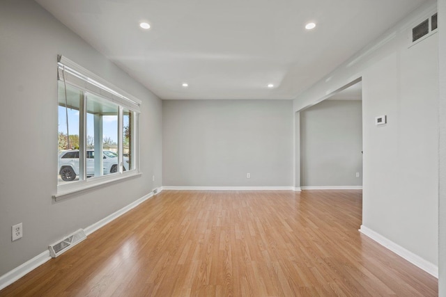 unfurnished room featuring recessed lighting, visible vents, and light wood-style flooring