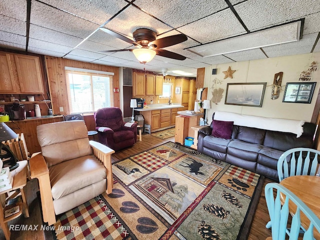 living room featuring a ceiling fan and light wood finished floors