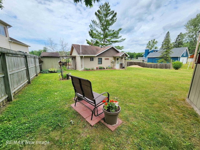 view of yard with a fenced backyard