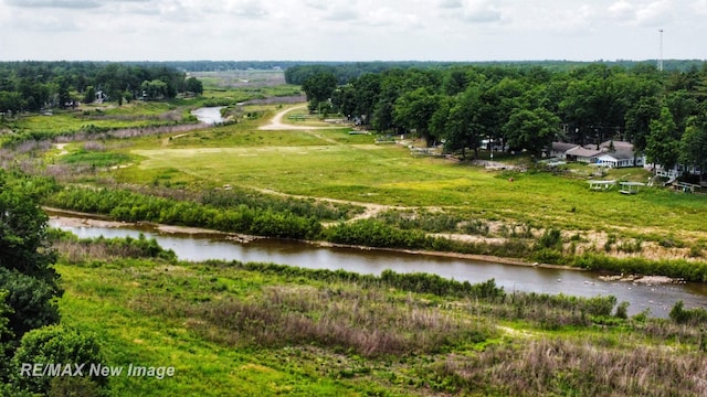 aerial view with a water view and a rural view