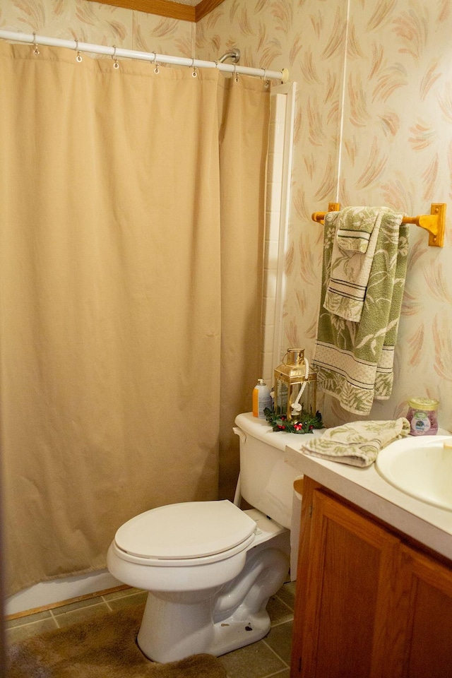 full bathroom with a shower with curtain, vanity, tile patterned floors, toilet, and wallpapered walls