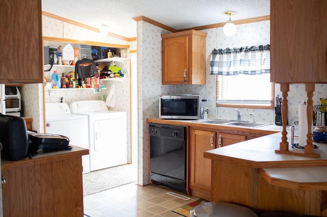 kitchen featuring washing machine and clothes dryer, stainless steel microwave, dishwasher, and wallpapered walls