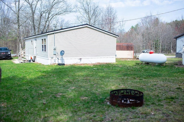 view of side of property featuring a yard